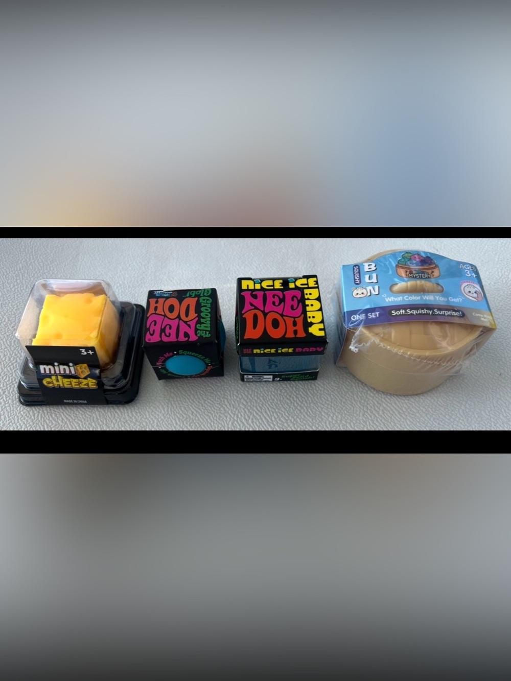 NeeDoh Mini’s groovy glob, ice baby, Dumpling and Mini Cheese Stress Toys